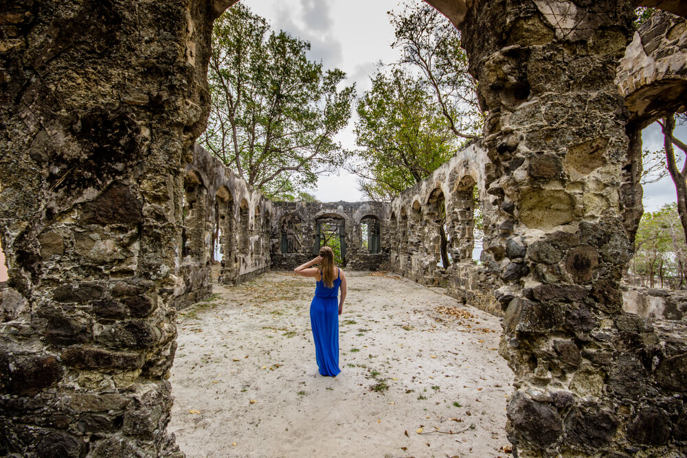 Woman in the ruins in Pigeon Island National Park in Saint Lucia

