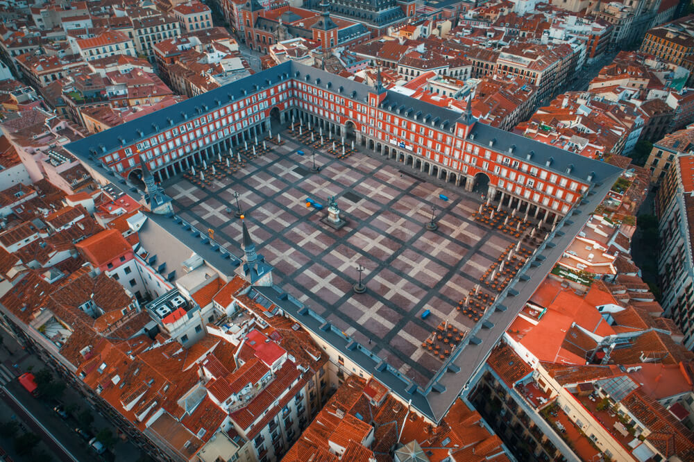 Madrid plaza Mayor aerial view with historical buildings in Spain.
