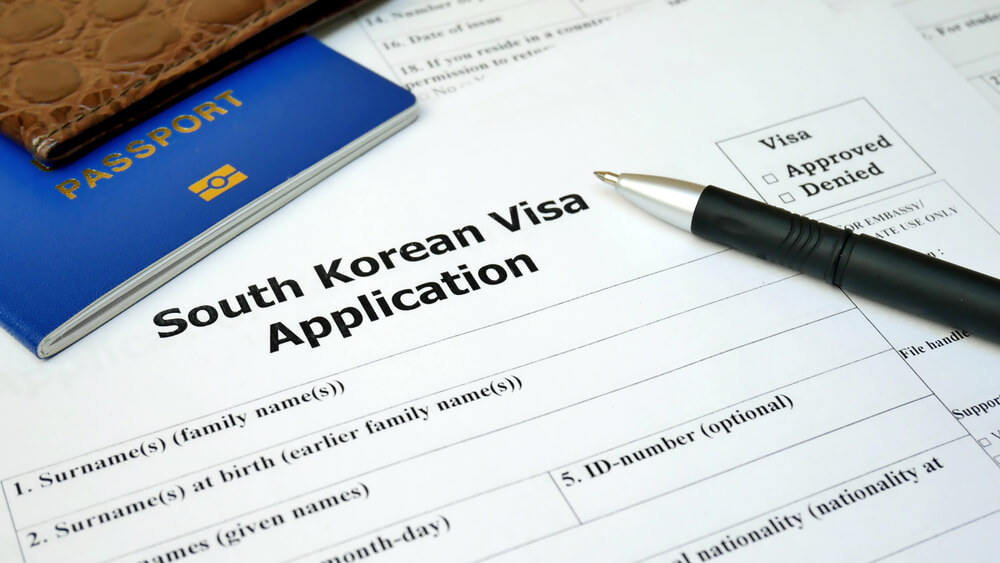 South Korean Visa application form with passport and pen. Document with passport, apply and permission for foreigner country
