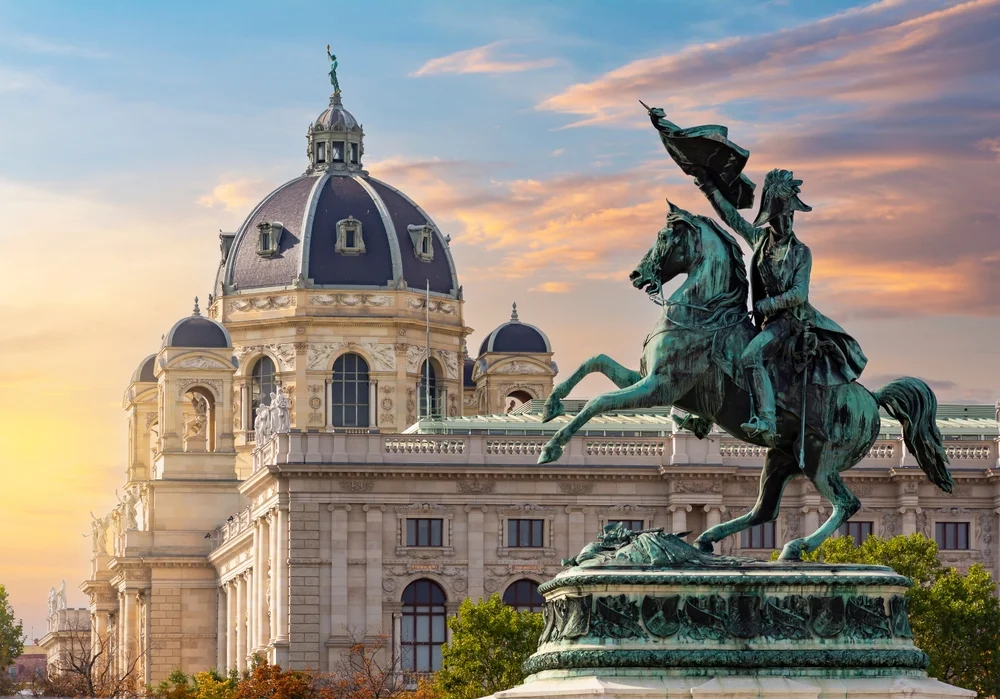 Statue of Archduke Charles on Heldenplatz square and Museum of Natural History dome at sunset, Vienna, Austria travel guide
