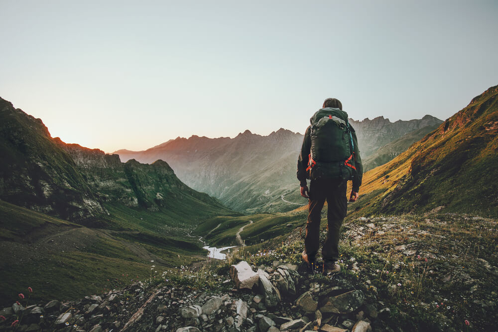 man on the mountain climbing and staying fit