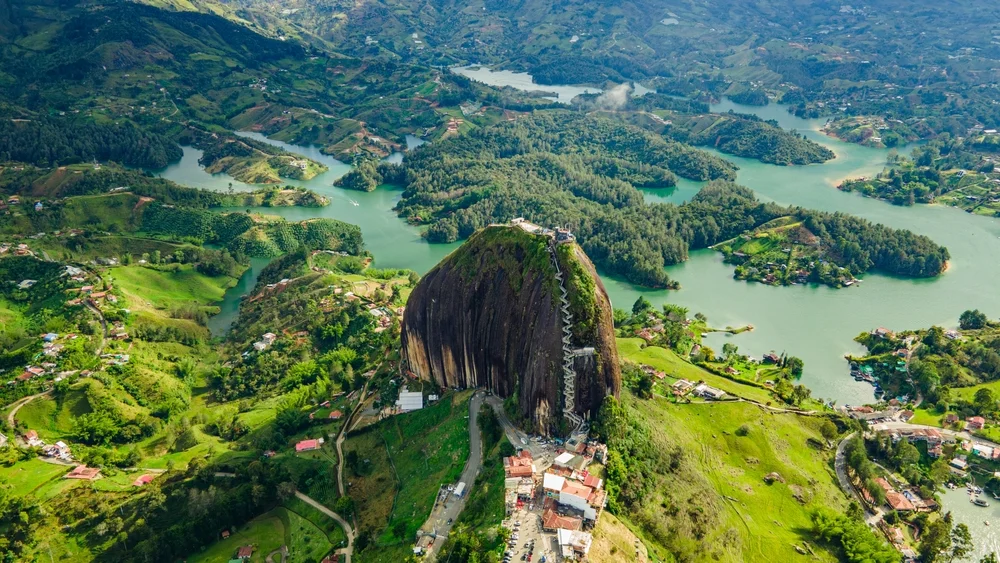 Aerial view of the Peñol stone next to the Lake or reservoir in Guatape, Antioquia, Colombia, located near the city of Medellín
