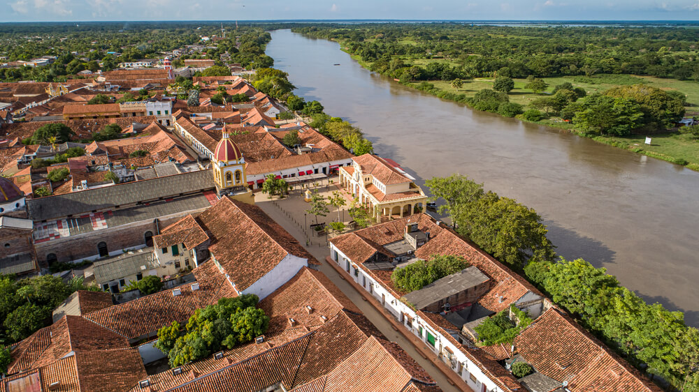 Aerial view of the historic town Santa Cruz de Mompox and river in sunlight, Colombia, World Heritage
