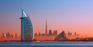 Dubai city - amazing city center skyline and famous Jumeirah beach at sunset, United Arab Emirates