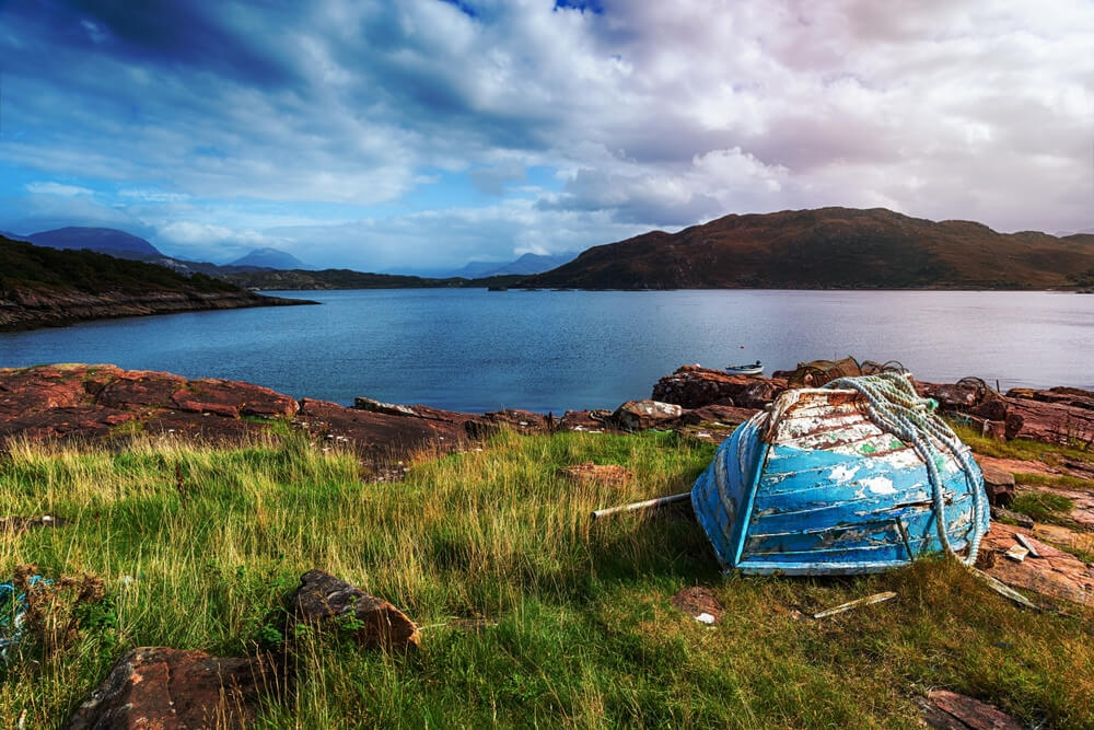 An old boat on the shore at Kenmore on the Applecross Peninsula in Scotland
