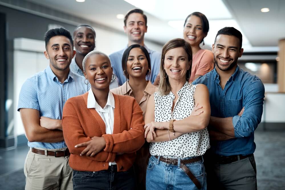 Diversity, portrait of happy colleagues and smile together in a office at their workplace. Team or collaboration, corporate workforce and excited or cheerful group of coworker faces, smiling at work
