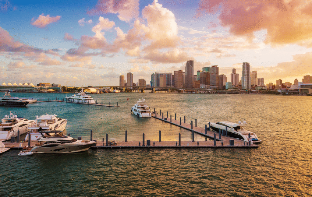 Miami skyline at sunset with yachts docked in Biscayne Bay, highlighting one of Florida’s vibrant and safe cities to live.
