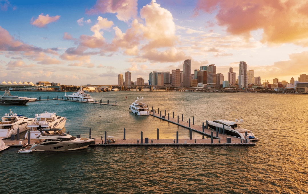 Miami skyline at sunset with yachts docked in Biscayne Bay, highlighting one of Florida’s vibrant and safe cities to live.
