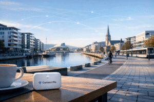Ultra-realistic Nordic city waterfront representing one of the safest cities to live in 2026, featuring a ConnectPls portable WiFi device for reliable expat connectivity.