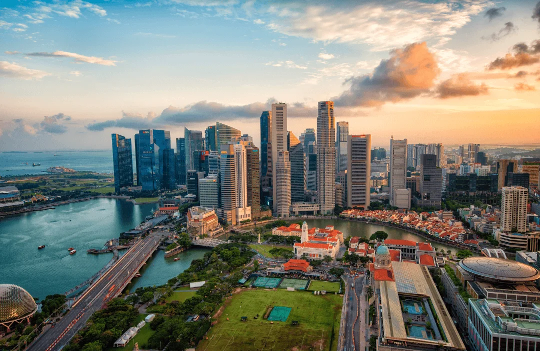 Aerial view of Singapore skyline at sunset showing Marina Bay, modern skyscrapers, and the vibrant city center — perfect destination for digital nomads using ConnectPls portable WiFi or eSIM.