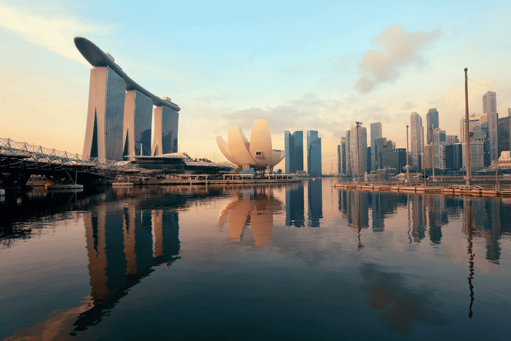 Aerial view of Singapore skyline at sunset showing Marina Bay, modern skyscrapers, and the vibrant city center — perfect destination for digital nomads using ConnectPls portable WiFi or eSIM.