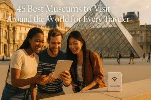 Tourists using ConnectPls portable Wi-Fi outside the Louvre Pyramid in Paris, one of the top museums in the world, staying connected while exploring cultural landmarks