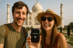 Happy tourists using ConnectPls portable WiFi in front of the Taj Mahal, Agra, India – showcasing seamless travel connectivity for digital nomads and international travelers